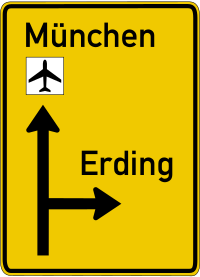 The advance notice sign indicates the direction as well as the number of lanes in each direction.