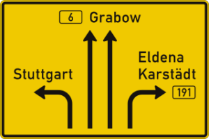 The advance notice sign indicates the direction as well as the number of lanes in each direction.